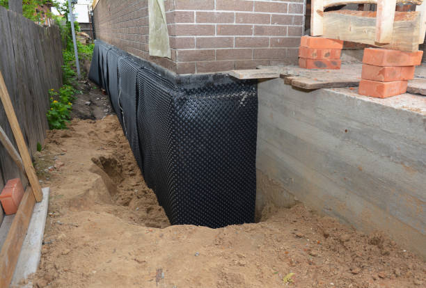 SJ Waterproofing Pros technician performing targeted Sump Pump Installation assessment in Troy, TN